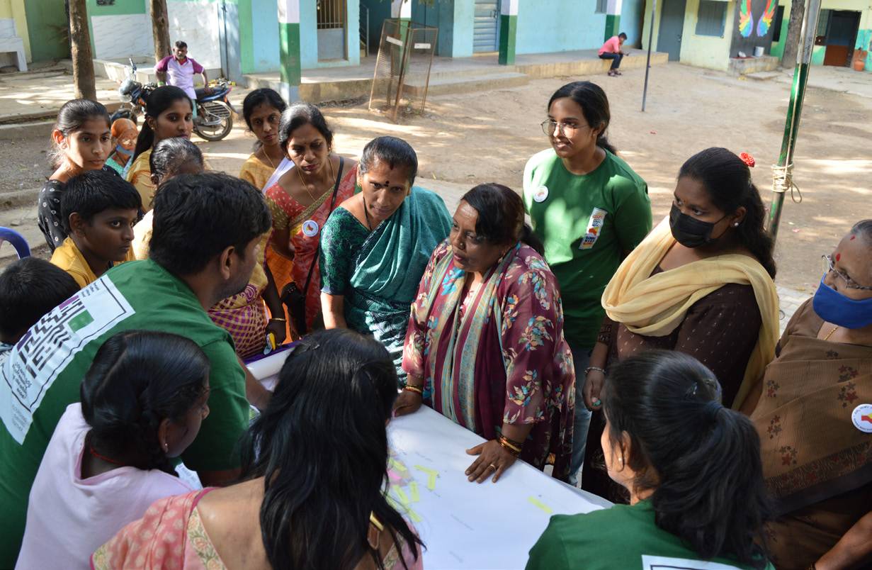 Volunteers mapping with residents outdoors