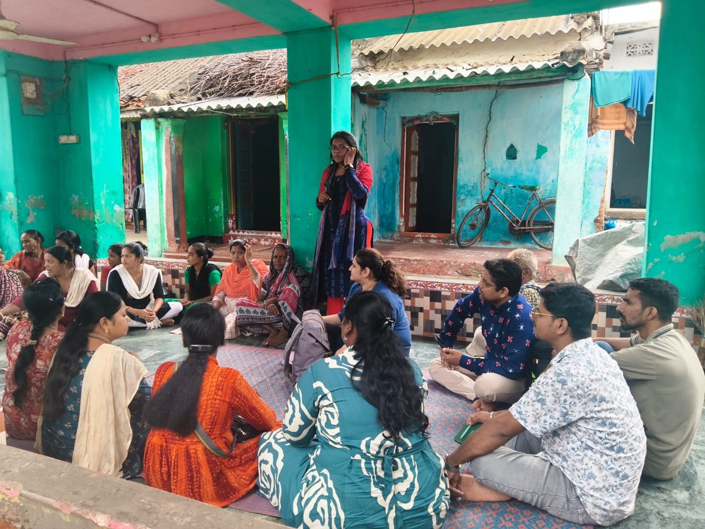 A community meeting with women in a coastal village