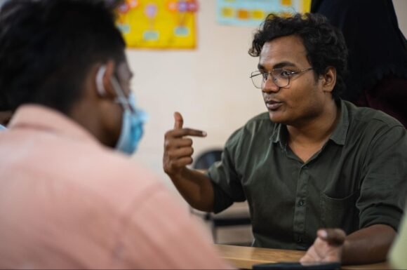 Mayur speaking during a workshop session